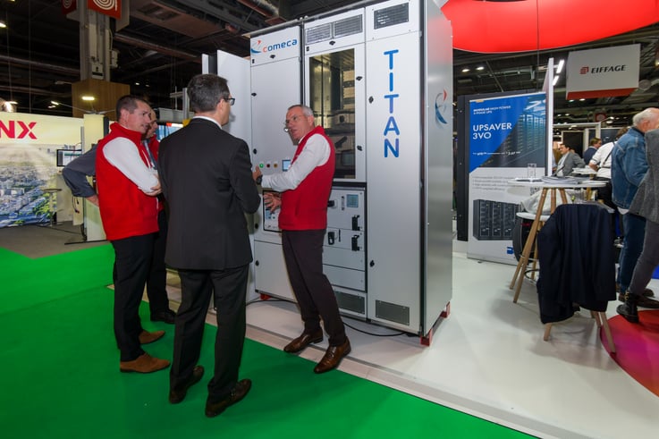 Photo Comeca team presenting TITAN switchboard at the Data Centre World 2022